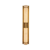 Niori Averna LED framed alabaster wall light in brushed brass, with two stacked veined alabaster cylinders joined by a central brass collar.
