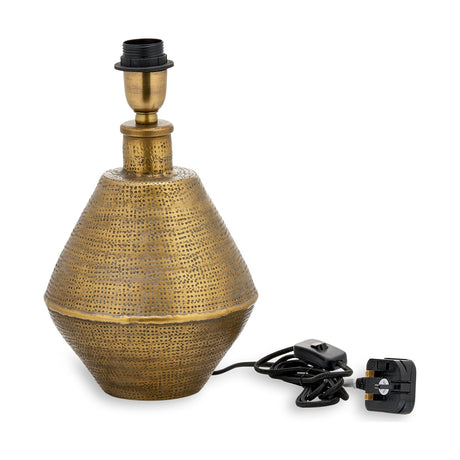 Nalgonda Small Lamp Base in antique brass iron, two-cone shape with punched dot bands and E27 fitting, shown with cord and UK plug on a white background.