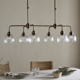 Kakira Ribbed Glass 6 Light Chandelier - Clear & Antique Brass in a kitchen