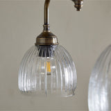 Kakira Ribbed Glass 6 Light Chandelier - Clear & Antique Brass in a dining room, view 3