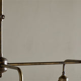Kakira Ribbed Glass 6 Light Chandelier - Clear & Antique Brass in a kitchen, view 3