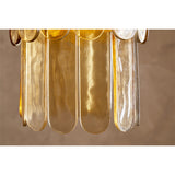 Close-up of the Itan Tiered Recycled Glass Pendant Light in amber, showing overlapping rounded glass paddles in a tiered arrangement against a neutral background.