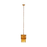 Itan Tiered Recycled Glass Pendant Light in Amber, with flat glass paddles on two brass rings and a long chain drop, shown on a plain white background.