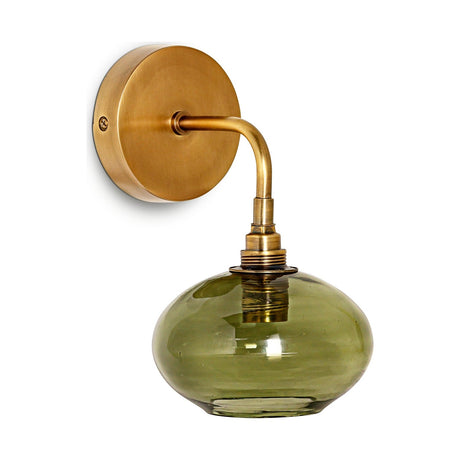 Otoro Recycled Glass Wall Light in Green: a round brass wall plate with curved arm holding a flattened olive-green glass shade on a ribbed brass collar, shown on a white background.
