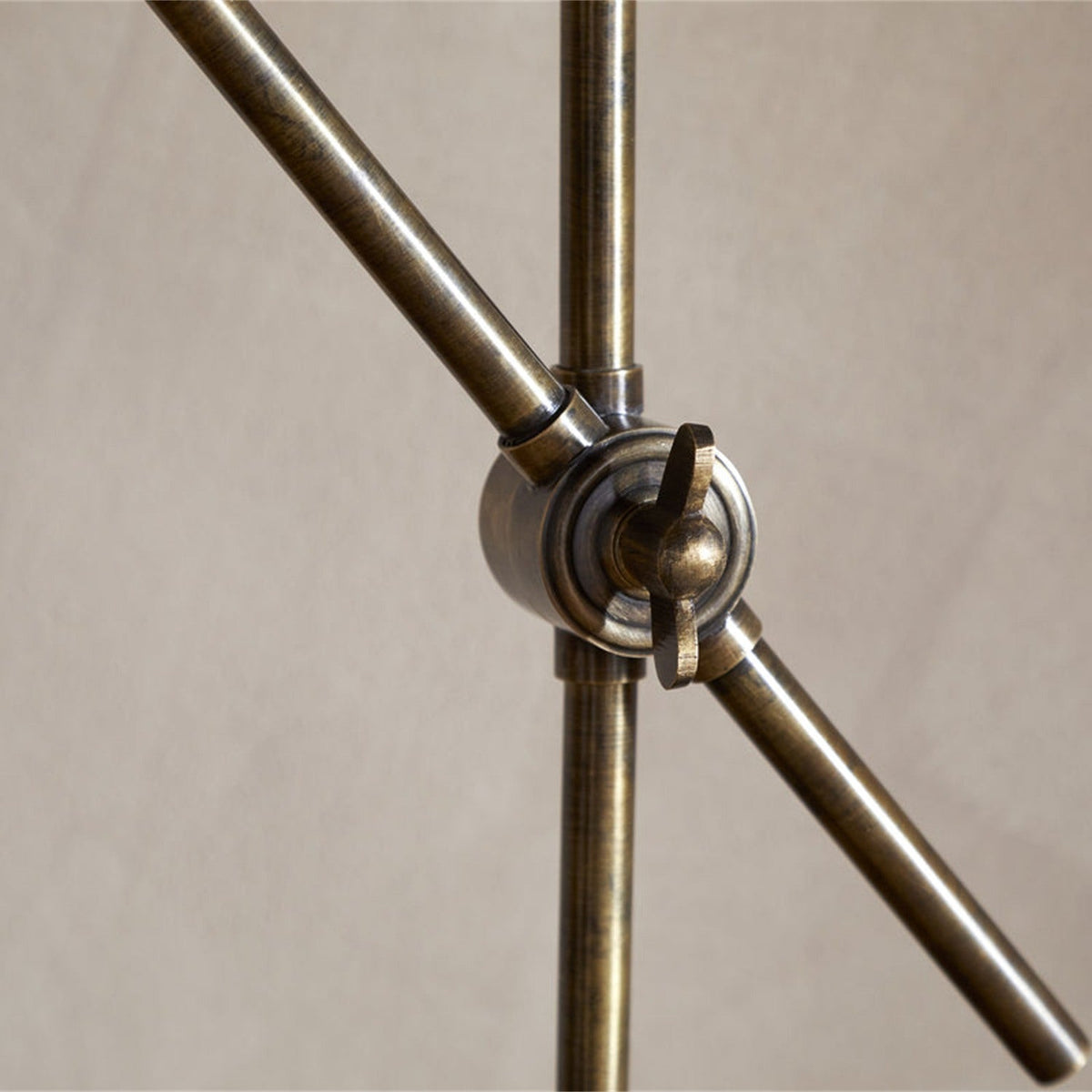 Thenkara Directional Desk Lamp - Antique Brass in a study, view 5