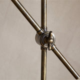 Thenkara Directional Desk Lamp - Antique Brass in a study, view 5