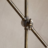 Thenkara Directional Desk Lamp - Antique Brass in a study, view 11