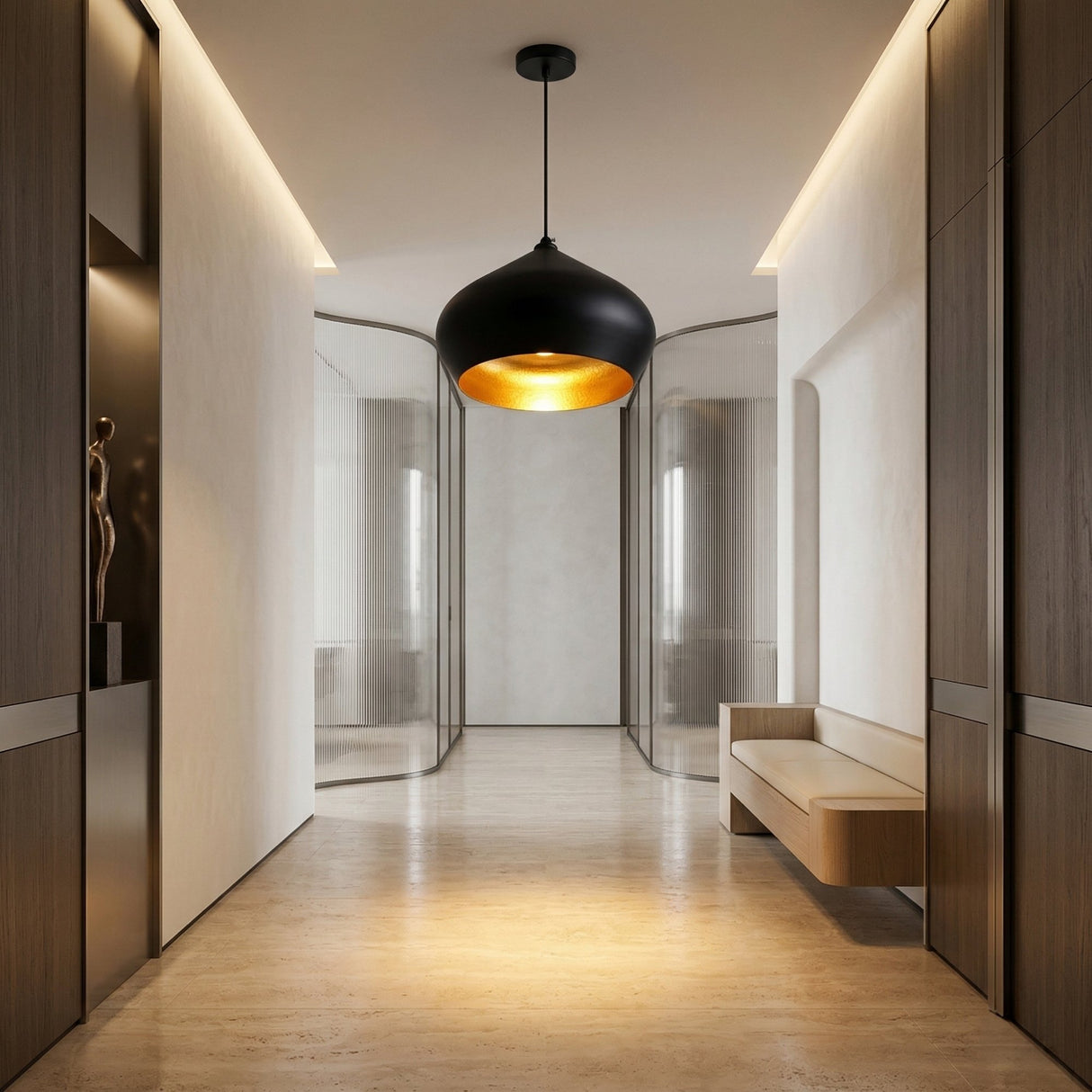 A modern hallway features beige floors, wooden wall panels, a Funk Stout Large Pendant Light in black with gold interior, a minimal wooden bench, a decorative statue in a niche, and glass doors at the corridor’s end.