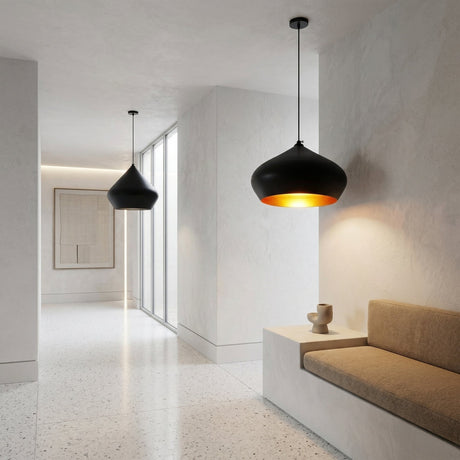 A modern minimalist hallway with white walls, terrazzo floor, the Funk Stout Large Pendant Light in black, a beige cushioned bench, a small decorative vase, and a large window that fills the space with natural light.