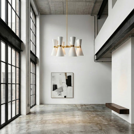 A modern minimalist room features tall windows, concrete floors, a striking Ramses 8 Light Chandelier - White, a black and white abstract painting on a white wall, and a floating wooden bench.