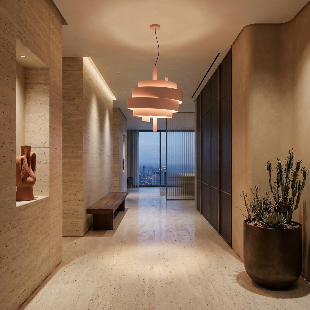 A modern hallway with beige stone walls and floors, a wooden bench, abstract sculpture, large potted cactus, and the striking Picasso Pendant Light - Pink. Floor-to-ceiling windows at the end reveal a sweeping city view.