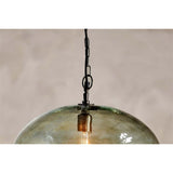 Otoro Large Round Recycled Glass Pendant Light in green, close-up of the smoky glass dome with brass collar, chain suspension and visible bulb, set against a plain background.