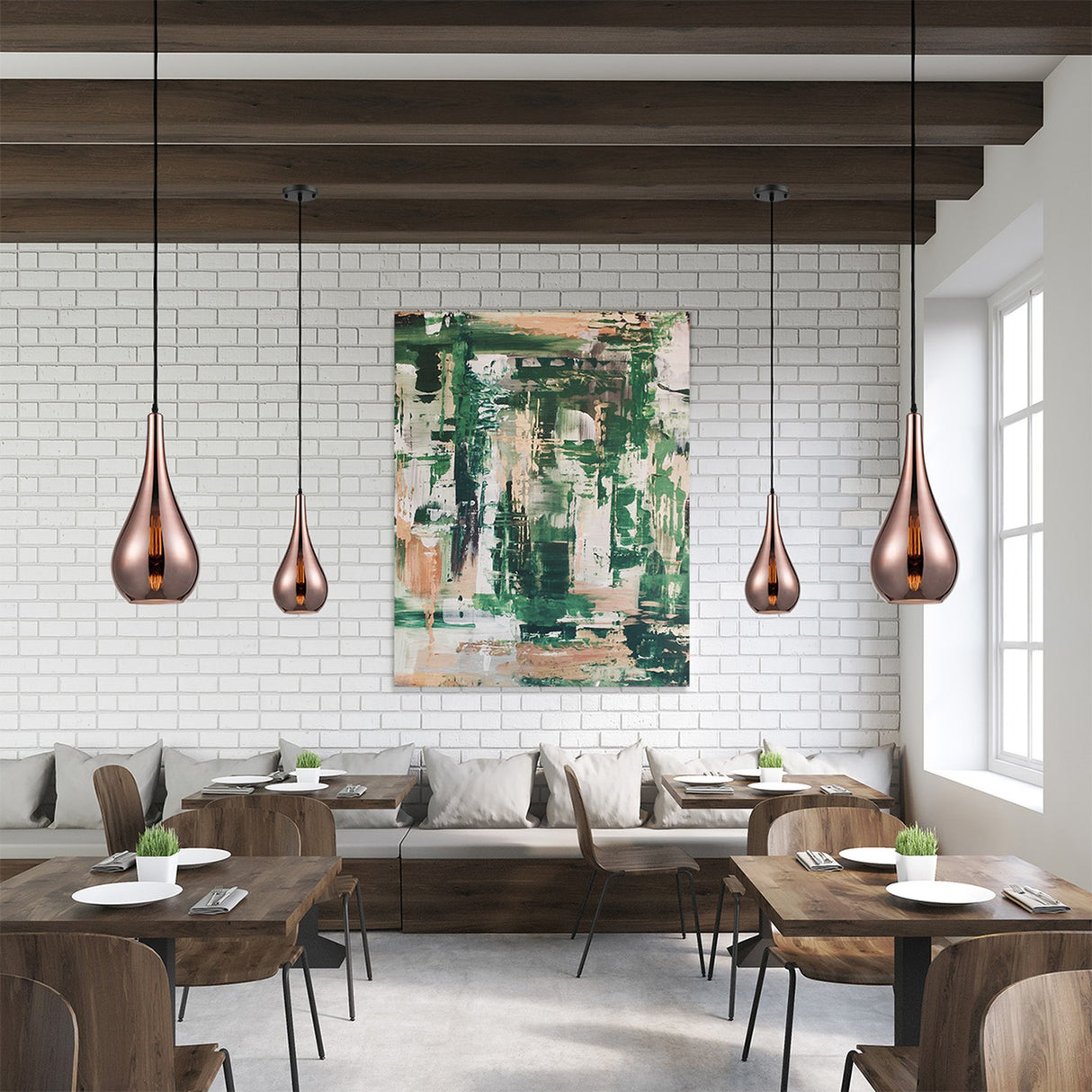 Droplet pendant light in copper finish, shown in a room setting