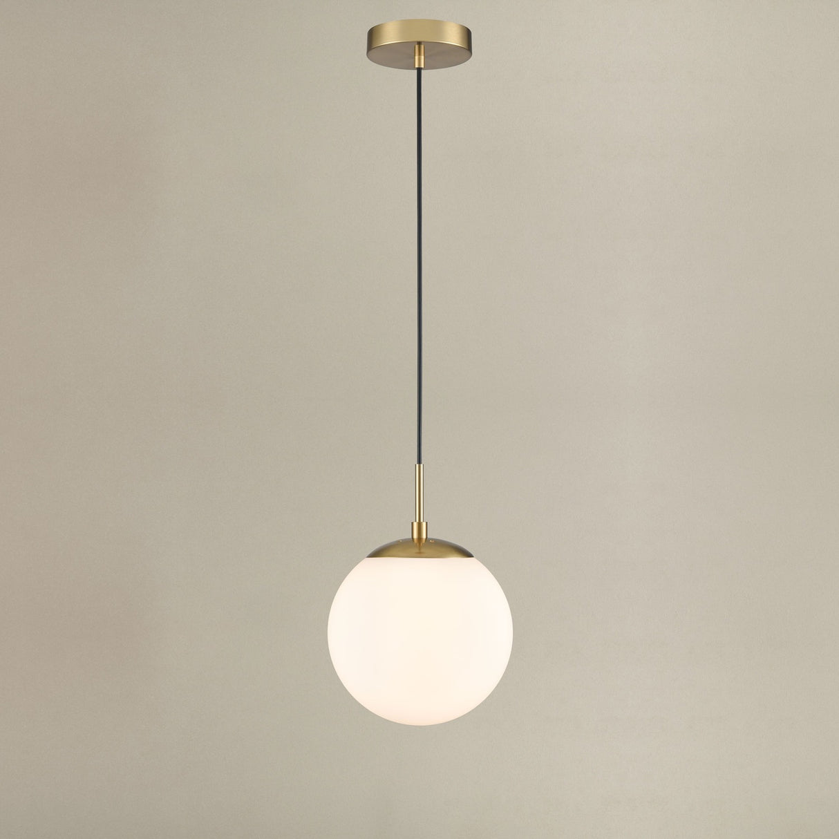 Galaxy pendant light in gold finish, shown on a dark background