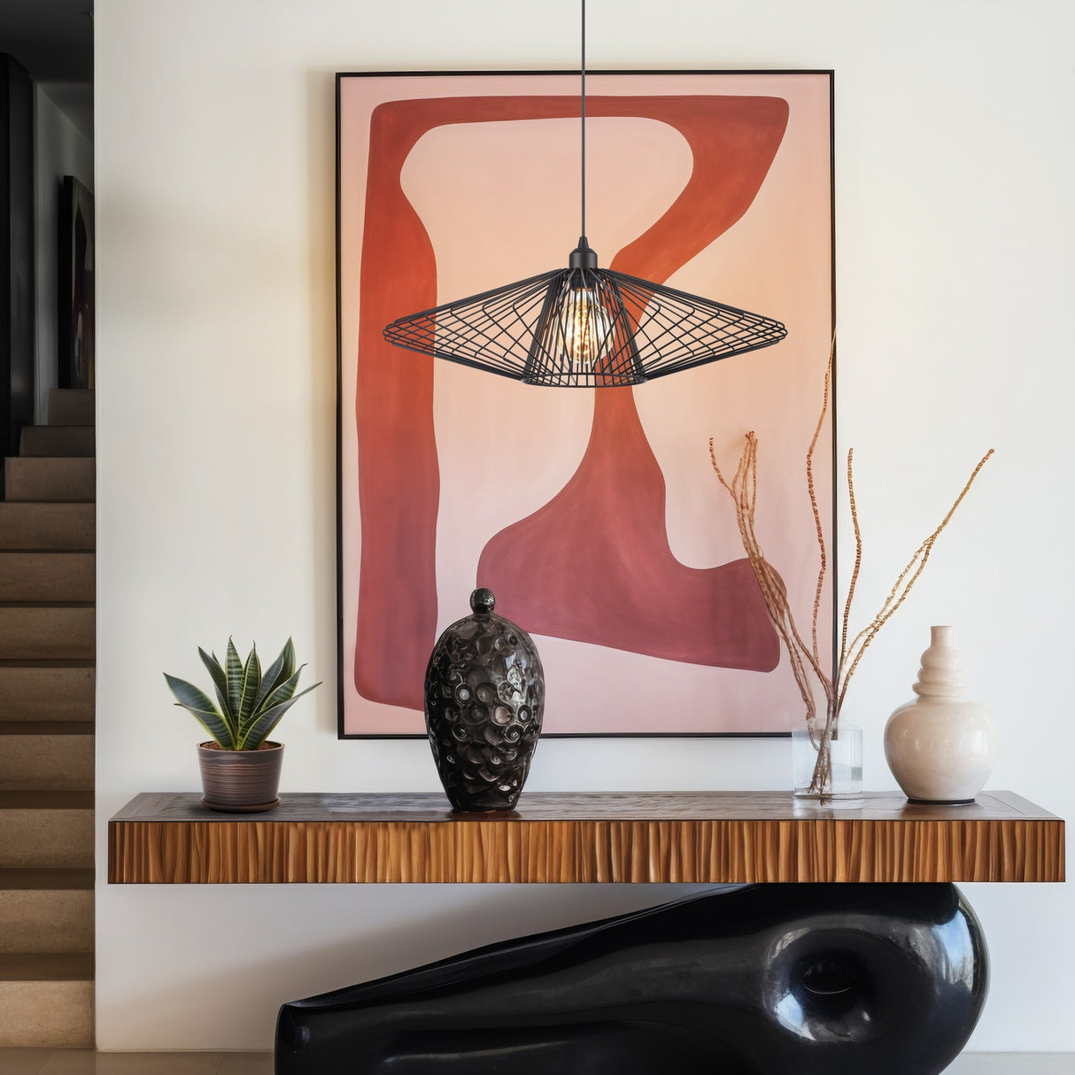 Thatch pendant light in black finish, shown in a room setting