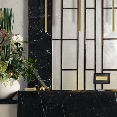 Chime pendant light in brass finish, shown in a room setting