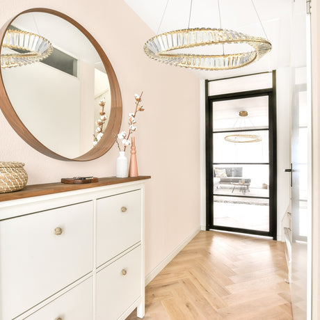 Cleopatra chandelier in brass finish, shown in a room setting