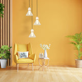 Bliss pendant light in brass finish, shown in a room setting