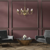 Halle 8 light chandelier in bronze finish, shown in a room setting