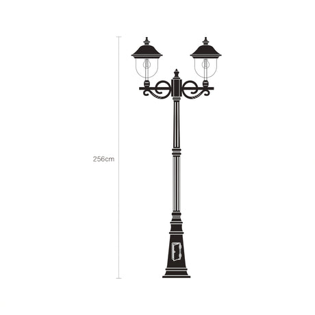 Volute 256cm outdoor lamp post in black with two lantern heads on scrolled brackets, cast plinth with an access door, shown as a line illustration with height marked on a white background.