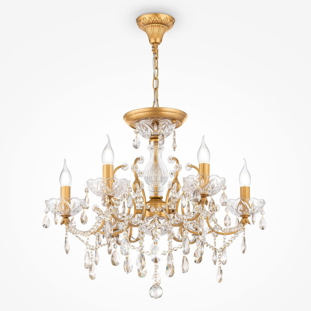 The Sevilla 6 Light Chandelier - Gold features an ornate design with a luxurious appearance. It includes six candle-shaped bulbs, intricate decorative crystals, hanging droplets, and is suspended by a gold chain and ceiling mount.