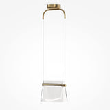 The Cabaret LED Pendant Light - Brass boasts a minimalist design with a clear glass shade and features elegant gold accents. Its unique elongated shape includes a gold handle extending from the ceiling to a gold ring at the middle, set against a white background.