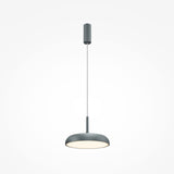 The Gerhard LED Dome Pendant Light 30cm in Grey features a sleek design with adjustable wire length, hanging elegantly while its round shade enhances energy efficiency and softly illuminates the plain white background.