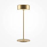 The AI Collaboration Rechargeable LED Table Lamp in gold showcases a modern minimalist design with a cylindrical shade and slender straight stand on a round base against a white background.