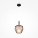 The Duality Round Pendant Light features a Noble Coffee glass shade with a visible bulb, suspended by a thin white cord from a black ceiling mount, embodying modern industrial lighting against a plain white backdrop.