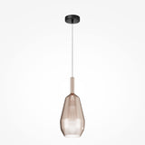 The Duality Teardrop Pendant Light features a sleek black finish and noble coffee glass shade in an elongated, tapered design. Suspended by a thin wire from a black circular mount, it embodies modern industrial elegance against a plain white background.