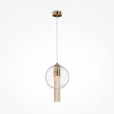 Introducing the Flusso Small Chain Pendant Light in bronze, featuring thin cables and a clear glass ball that encases metallic tassels for an ambient glow. It hangs elegantly from a gold mount against a white background, adding sophistication to any space.