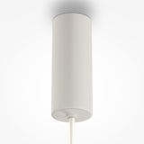 The Gerhard LED Dome Pendant Light 40cm in white, with a sleek cylindrical shape and power cord, offers energy-efficient lighting that complements a modern minimalist interior against a light background.
