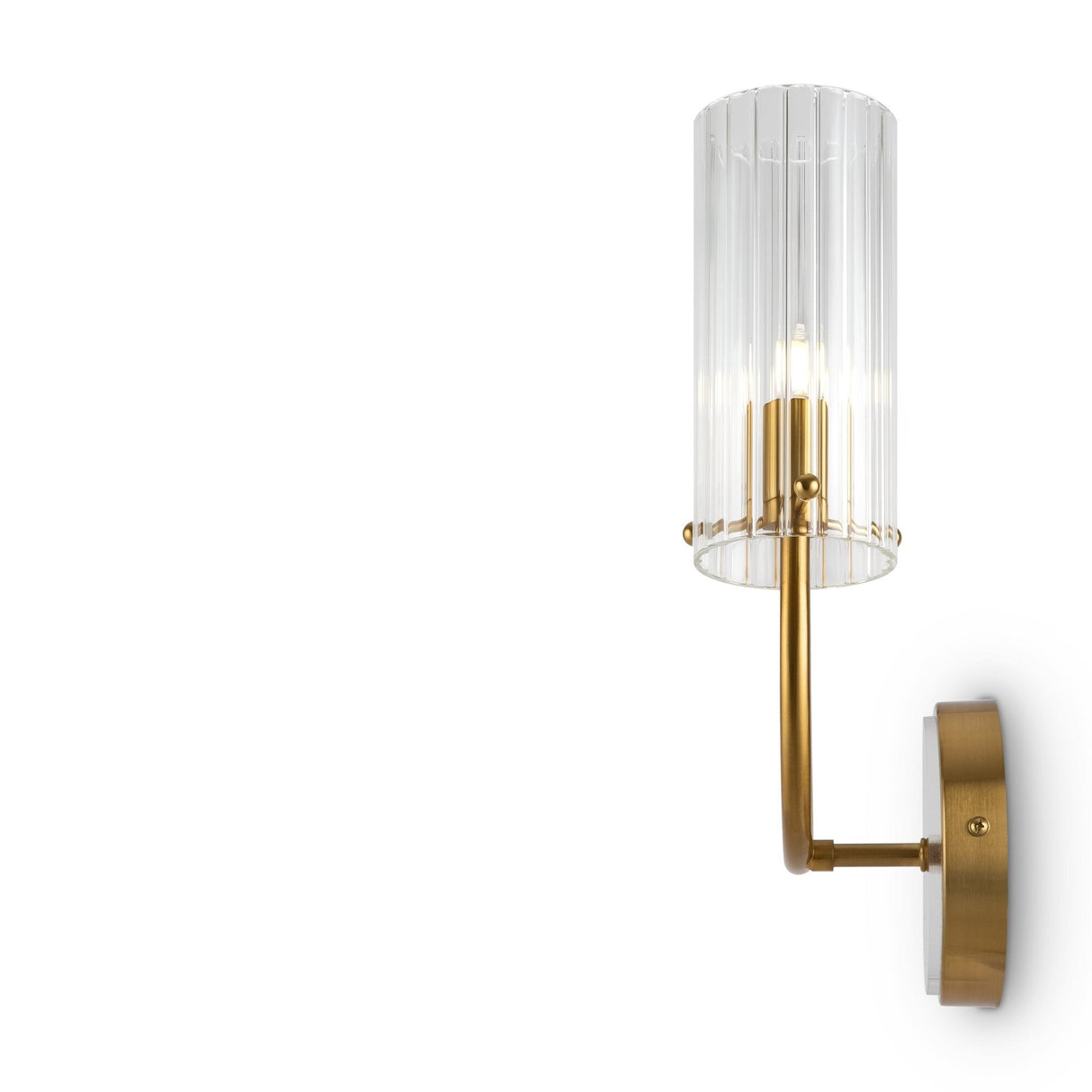 The Arco 2 Light Wall Light (MOD223WL-02BS) features a brass base and arm with a vertical ribbed glass, elegantly housing a single bulb, and is mounted on a plain white wall.