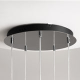 The Drop LED Cluster Pendant Light 80W 3000K - Chrome features a chrome black circular base with transparent cords hanging from it, showcasing an energy-efficient, minimalist, and contemporary design against a light-colored ceiling.