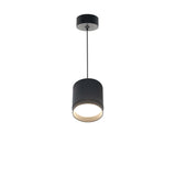 The Polar Short Round Pendant Light - Black boasts a contemporary design with a matte black finish. Its cylindrical shade and slender stem hang elegantly from the ceiling, softly lighting the space below.