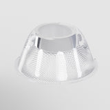 A clear, textured, funnel-shaped plastic object with a metallic interior on a white background features a hexagonal pattern. It resembles the Focus LED Track Light Lens ⌀55mm 36°, designed for customizable lighting and offering a 36° beam angle.