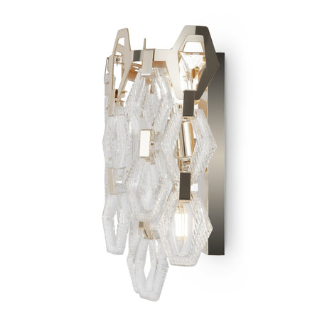 The Tissage 2 Light Wall Light features a geometric design with a gold metal frame and clear, textured glass hexagons, creating a sophisticated and contemporary look.