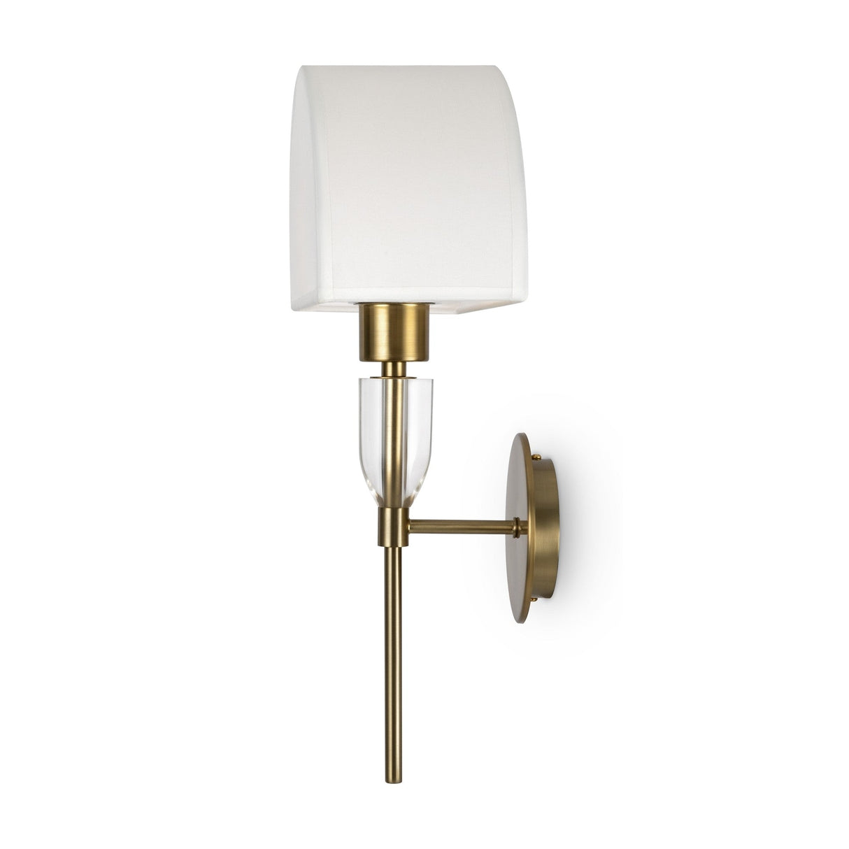 The Prima Wall Light - Brass With White Shade exemplifies modern lighting design with its brass-colored frame and base, rectangular white fabric shade, and clear glass accent. It features a circular backplate for ambient lighting.