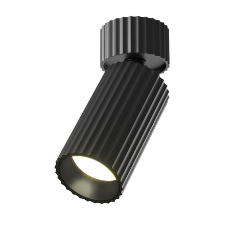 Maytoni Calipso LED adjustable ceiling spotlight in matt black with fluted ribbed aluminium cylindrical body and GU10 fitting, on a white background.