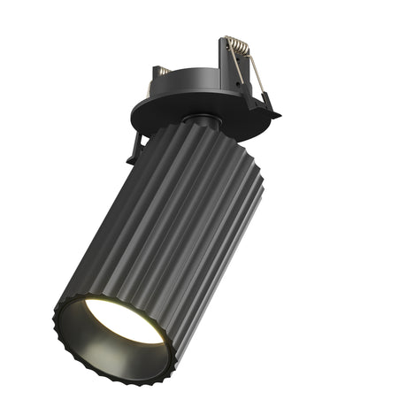 Maytoni Calipso recessed downlight in black with fluted aluminium cylindrical body, spring clips, and GU10 lamp aperture on a white background.