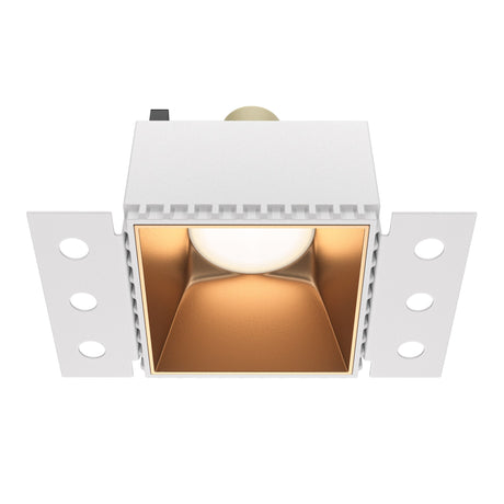 Share square plaster-in fixed recessed downlight in matte gold, adding a touch of elegance to interiors.