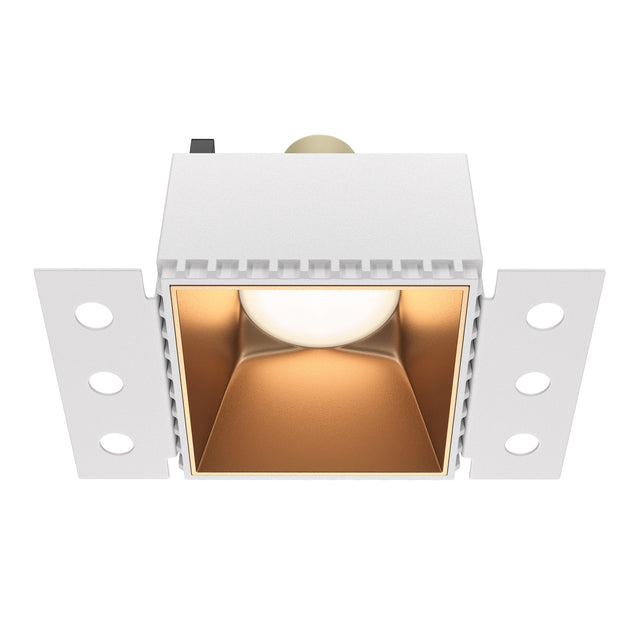 Share square plaster-in fixed recessed downlight in matte gold, adding a touch of elegance to interiors.