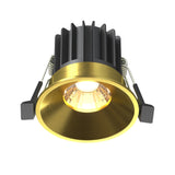 Round LED recessed downlight in brass, providing warm lighting for contemporary interior designs.