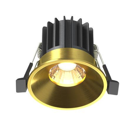 Round LED recessed downlight in brass, providing warm lighting for contemporary interior designs.