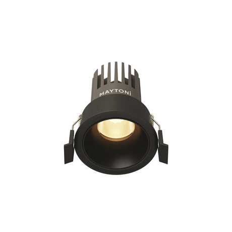 Maytoni Dip 10W LED recessed downlight in matt black aluminium with finned heat sink, deep-set reflector, and spring clips, shown on a white background.
