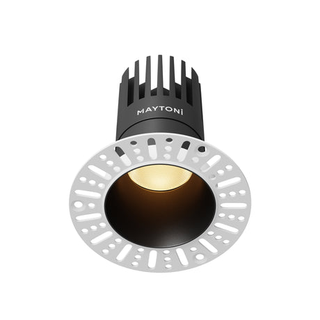 Maytoni Dip 15W 2700K recessed LED downlight with black aluminium trim, warm white lens and finned heat sink above a white mounting plate.