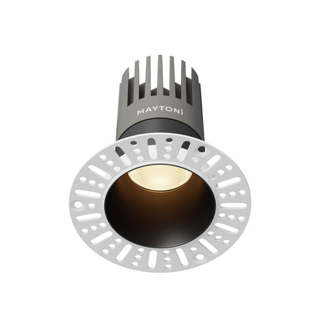 Maytoni Dip 103mm LED recessed downlight with black aluminium trim, integrated warm white module and white plaster mounting ring on a plain background.