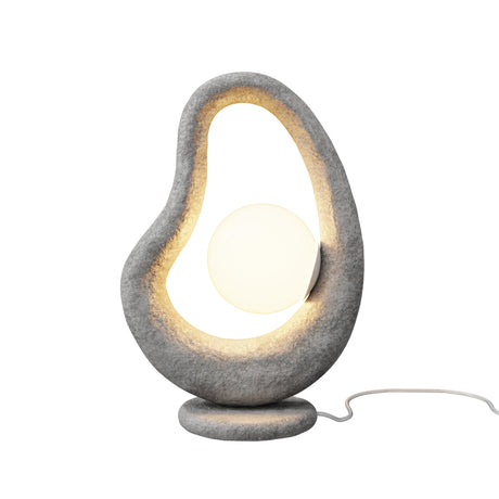 Maytoni Opus LED table lamp with sculptural grey stone-effect loop, frosted glass globe diffuser and rounded base on a white background.