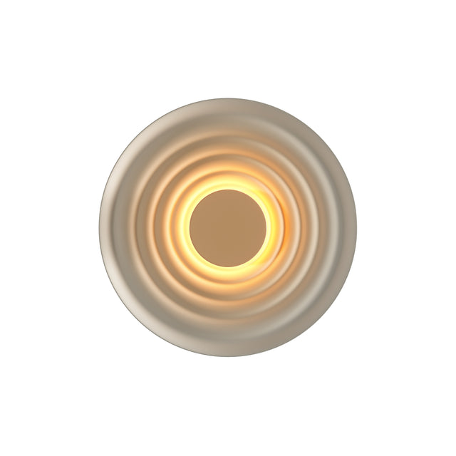 Maytoni Nami LED wall light with concentric ringed circular housing in grey, illuminated centre casting a warm halo, shown on a plain white background.