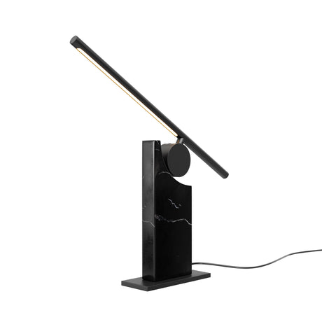 Maytoni Monumento LED table lamp with adjustable matt black metal arm on a veined black marble block base, set against a plain white background.